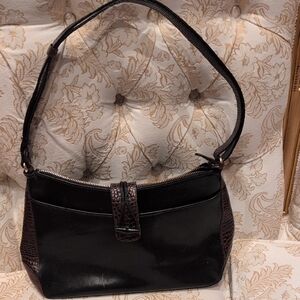 A Designer Brahmin Purse.  It Is Black Leather With Brown Crocodile Sides.